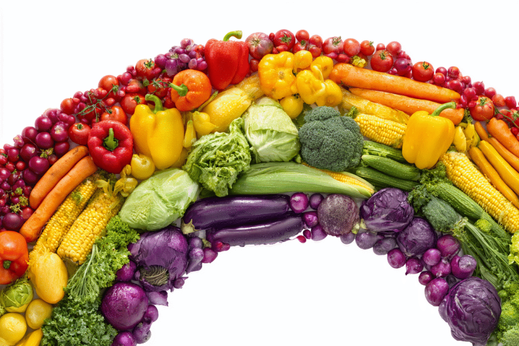 A rainbow made of colorful vegetables illustrating the answer to the FAQ on what vegetables are good for weight loss A rainbow made of colorful vegetables illustrating the answer to the FAQ on what vegetables are good for weight loss